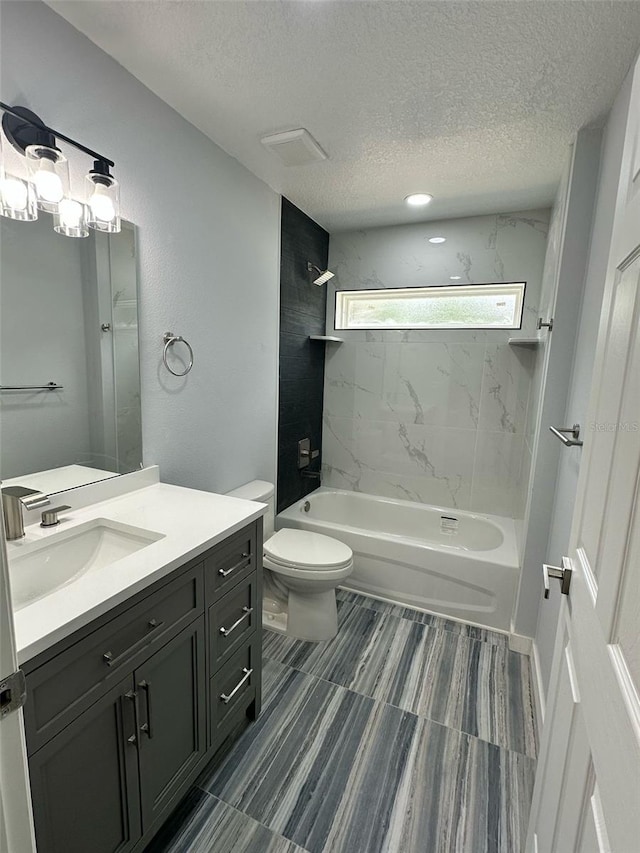 3082 SE 140th Ln, Summerfield, FL 34491 - full bath featuring toilet, vanity, bathtub / shower combination, and a textured ceiling