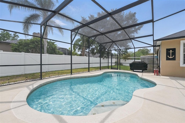 14848 Bonnybridge Dr, Orlando, FL 32826 - view of swimming pool featuring a patio area, a fenced backyard, glass enclosure, and area for grilling