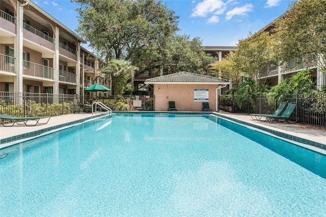 community pool featuring fence
