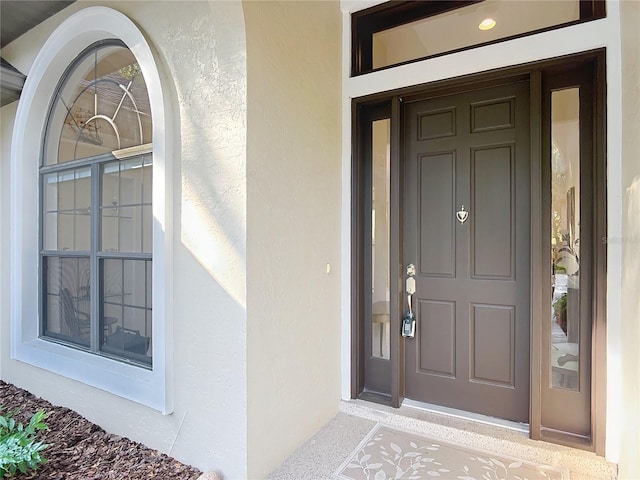 502 Canopy Ln, Lady Lake, FL 32159 - entrance to property featuring stucco siding