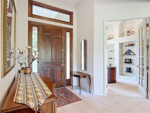 502 Canopy Ln, Lady Lake, FL 32159 - entryway with light tile patterned floors