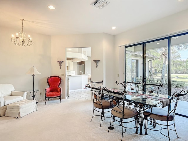 502 Canopy Ln, Lady Lake, FL 32159 - dining room featuring plenty of natural light, light colored carpet, a chandelier, and recessed lighting