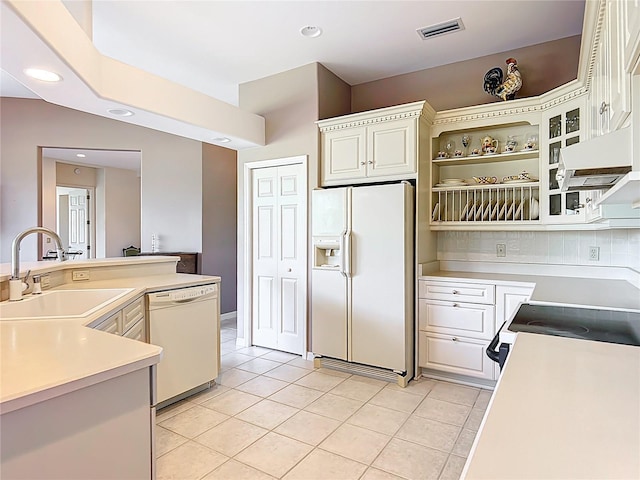 502 Canopy Ln, Lady Lake, FL 32159 - kitchen featuring white appliances, light tile patterned floors, light countertops, under cabinet range hood, and open shelves