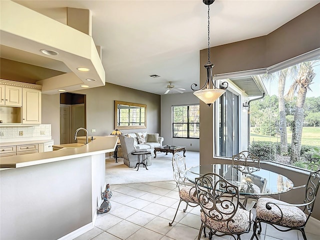 502 Canopy Ln, Lady Lake, FL 32159 - dining area with light carpet, light tile patterned floors, recessed lighting, and a ceiling fan
