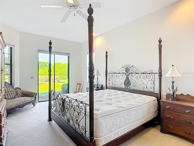 502 Canopy Ln, Lady Lake, FL 32159 - bedroom with access to exterior, light colored carpet, and ceiling fan