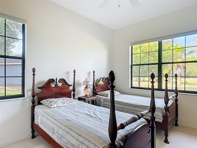 502 Canopy Ln, Lady Lake, FL 32159 - bedroom featuring light colored carpet and a ceiling fan