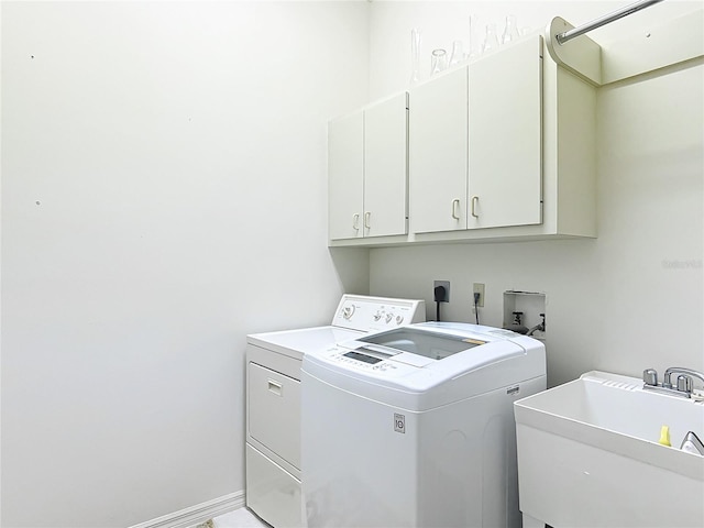 502 Canopy Ln, Lady Lake, FL 32159 - laundry room featuring cabinet space and independent washer and dryer