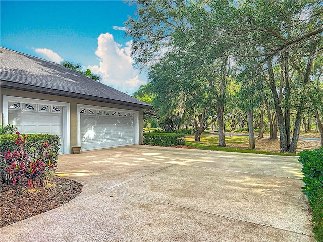 502 Canopy Ln, Lady Lake, FL 32159 - garage featuring driveway