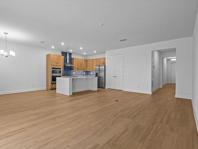8018 Colby Cir, Orlando, FL 32817 - unfurnished living room with a chandelier, recessed lighting, baseboards, light wood-type flooring, and a sink