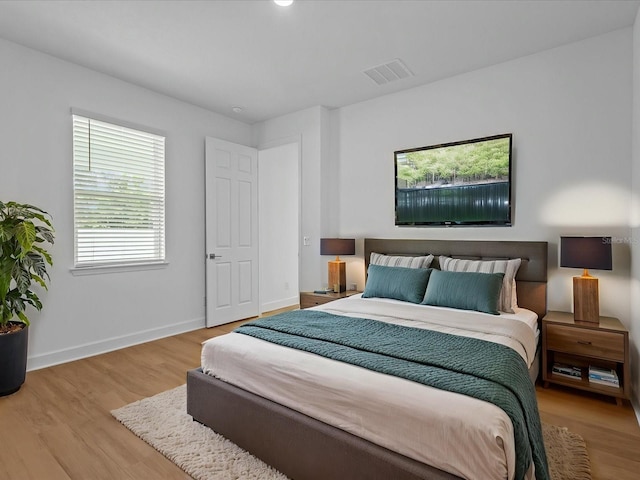 8018 Colby Cir, Orlando, FL 32817 - bedroom with wood finished floors and baseboards