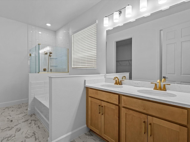 8018 Colby Cir, Orlando, FL 32817 - bathroom featuring marble look tile flooring, a tile shower, double vanity, and baseboards