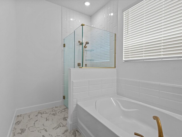 8018 Colby Cir, Orlando, FL 32817 - bathroom with baseboards, a bath, a shower stall, marble look tile flooring, and recessed lighting
