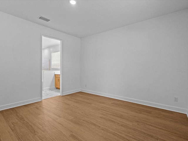 8018 Colby Cir, Orlando, FL 32817 - empty room featuring light wood-style floors, baseboards, and recessed lighting