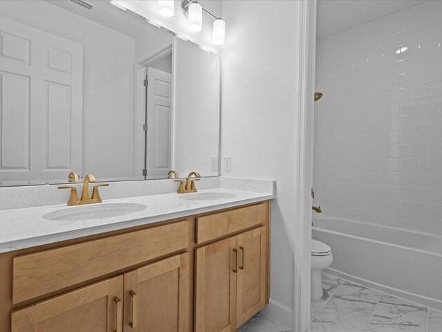 8018 Colby Cir, Orlando, FL 32817 - bathroom with double vanity, toilet, marble look tiles, shower / tub combination, and baseboards