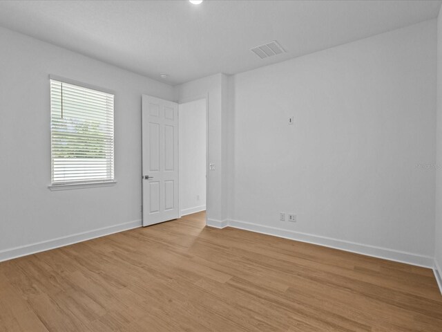 8018 Colby Cir, Orlando, FL 32817 - unfurnished room featuring baseboards and light wood finished floors