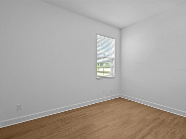 8018 Colby Cir, Orlando, FL 32817 - unfurnished room featuring light wood-style flooring and baseboards