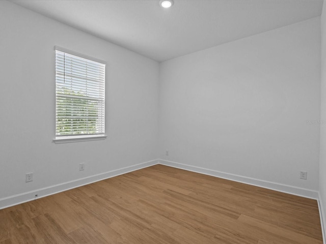 8018 Colby Cir, Orlando, FL 32817 - spare room featuring baseboards, light wood-type flooring, and recessed lighting