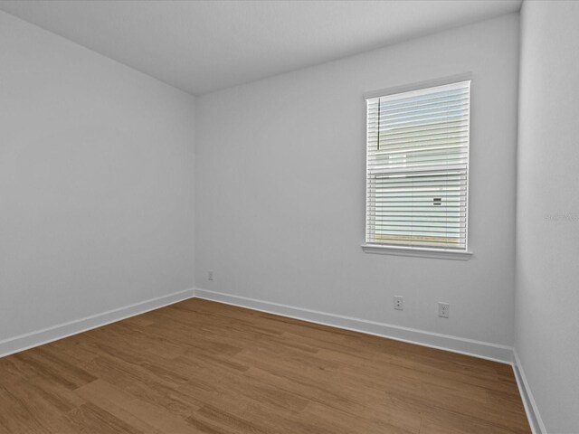 8018 Colby Cir, Orlando, FL 32817 - empty room featuring wood finished floors and baseboards