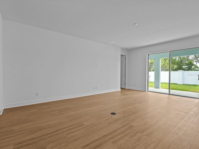 8018 Colby Cir, Orlando, FL 32817 - unfurnished room with light wood-style flooring and baseboards