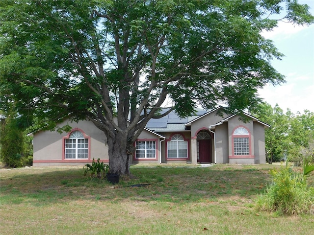 7045 Branch Ct, Saint Cloud, FL 34771 - ranch-style home featuring stucco siding and a front yard