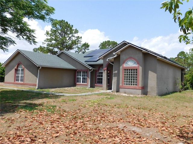 7045 Branch Ct, Saint Cloud, FL 34771 - ranch-style home with solar panels and stucco siding