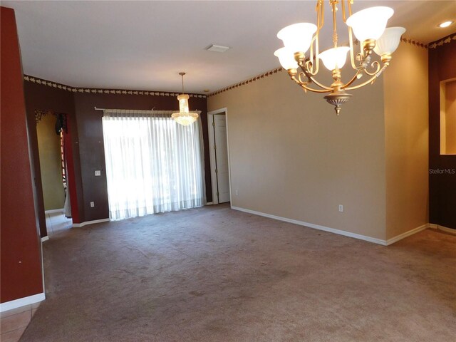 7045 Branch Ct, Saint Cloud, FL 34771 - spare room featuring a chandelier, baseboards, and carpet floors