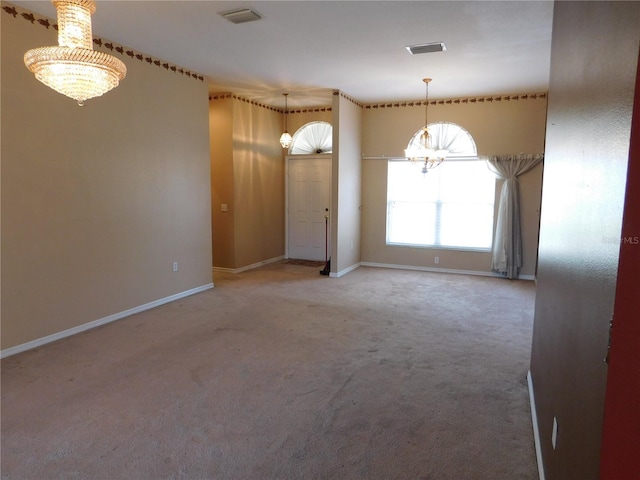 7045 Branch Ct, Saint Cloud, FL 34771 - empty room featuring a chandelier, carpet, and baseboards