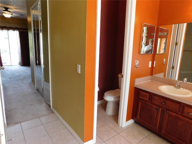 7045 Branch Ct, Saint Cloud, FL 34771 - bathroom featuring tile patterned floors, toilet, vanity, and ceiling fan