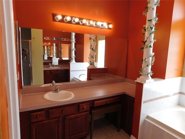7045 Branch Ct, Saint Cloud, FL 34771 - bathroom with a garden tub, tile patterned flooring, and vanity