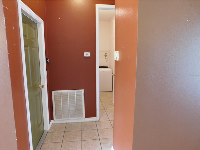 7045 Branch Ct, Saint Cloud, FL 34771 - hallway featuring light tile patterned floors and washer / clothes dryer