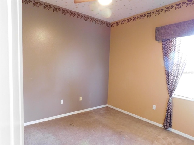 7045 Branch Ct, Saint Cloud, FL 34771 - empty room with light colored carpet, a ceiling fan, and baseboards