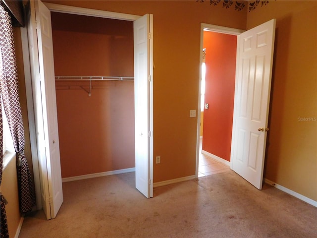 7045 Branch Ct, Saint Cloud, FL 34771 - unfurnished bedroom with light colored carpet, a closet, and baseboards