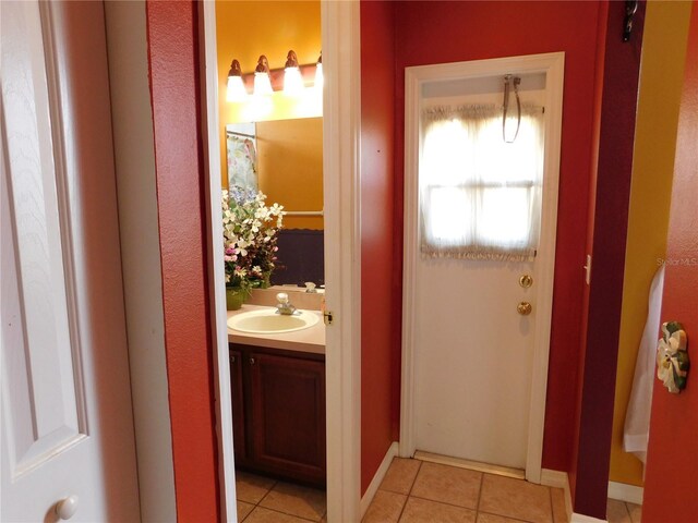 7045 Branch Ct, Saint Cloud, FL 34771 - bathroom with vanity, tile patterned floors, and baseboards