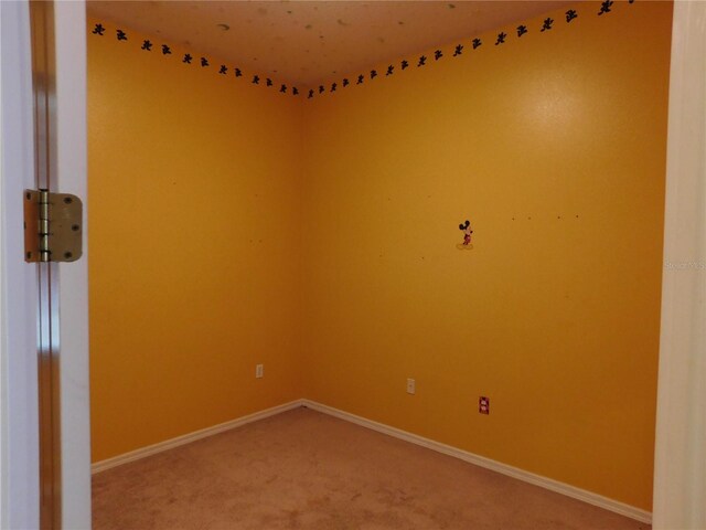 7045 Branch Ct, Saint Cloud, FL 34771 - spare room featuring light colored carpet and baseboards