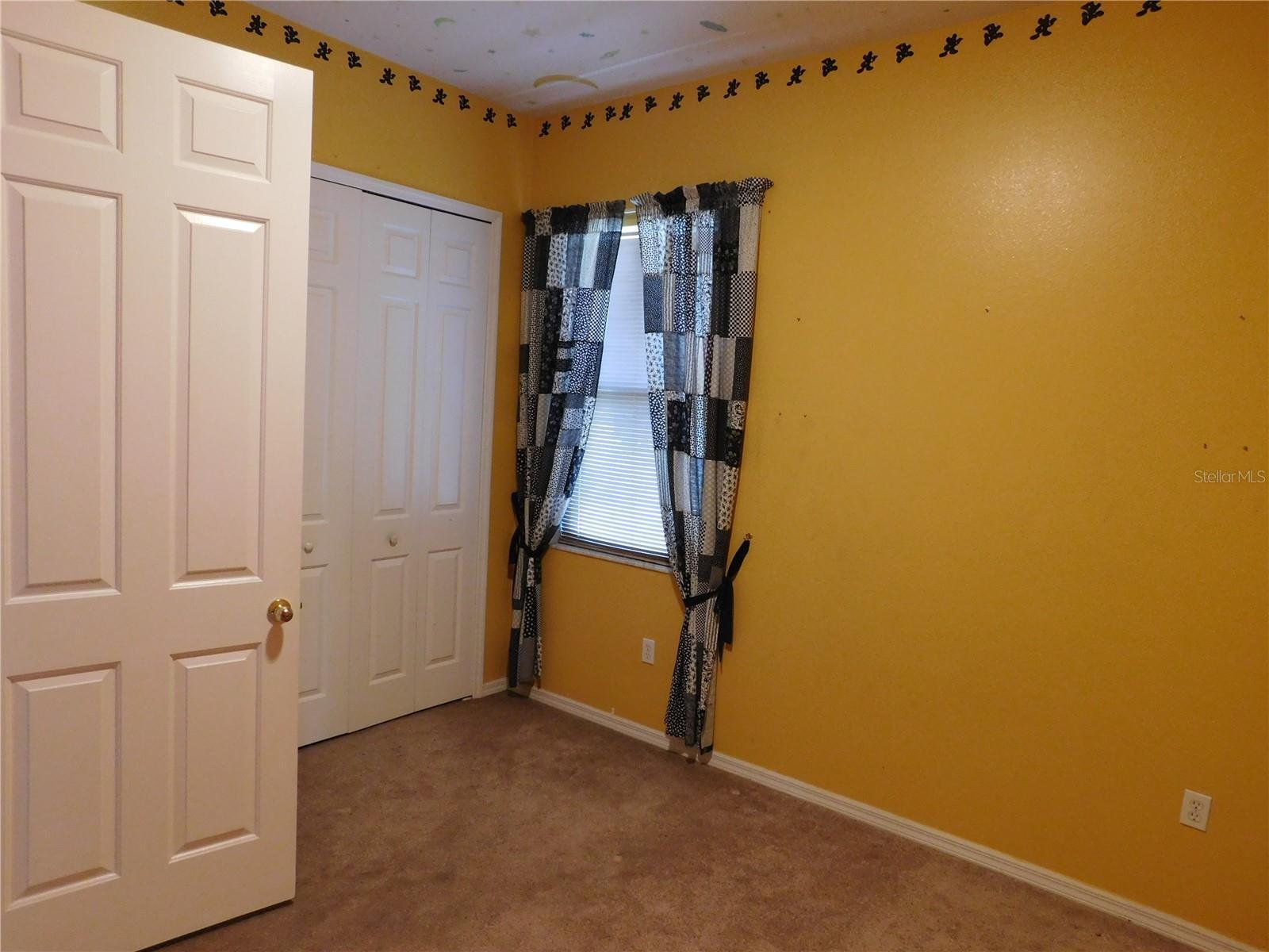 7045 Branch Ct, Saint Cloud, FL 34771 - carpeted spare room featuring baseboards
