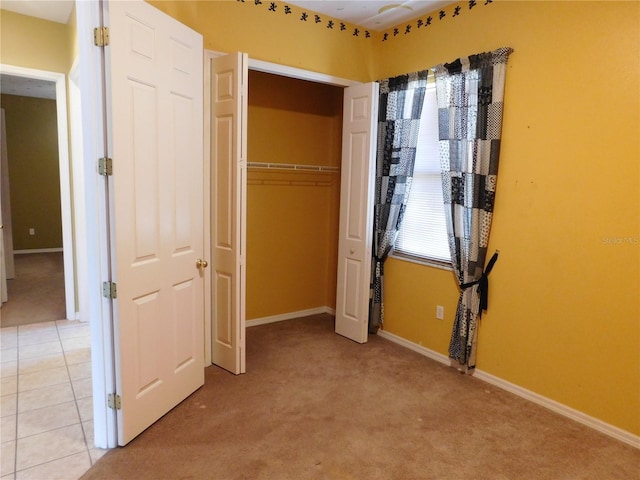 7045 Branch Ct, Saint Cloud, FL 34771 - unfurnished bedroom featuring light colored carpet, a closet, and baseboards