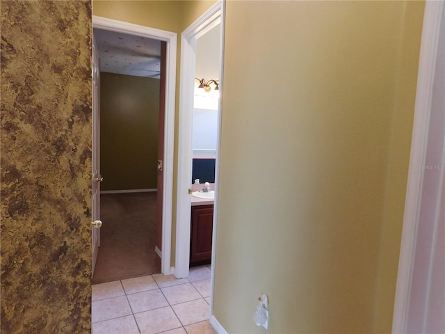 7045 Branch Ct, Saint Cloud, FL 34771 - corridor with light tile patterned flooring, light colored carpet, and baseboards