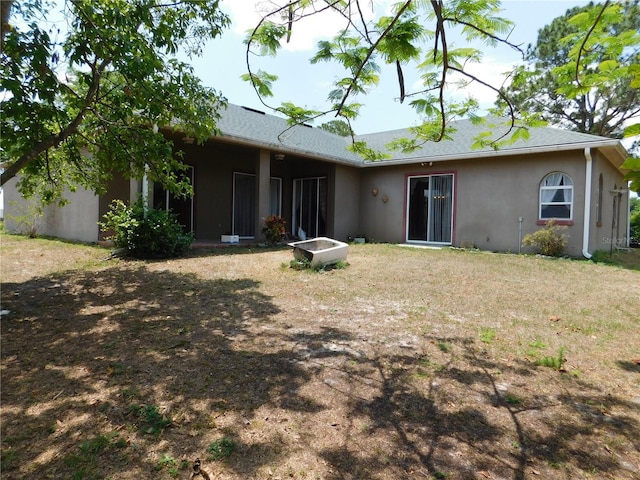 7045 Branch Ct, Saint Cloud, FL 34771 - rear view of property featuring stucco siding