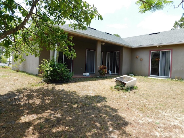 7045 Branch Ct, Saint Cloud, FL 34771 - rear view of house featuring stucco siding