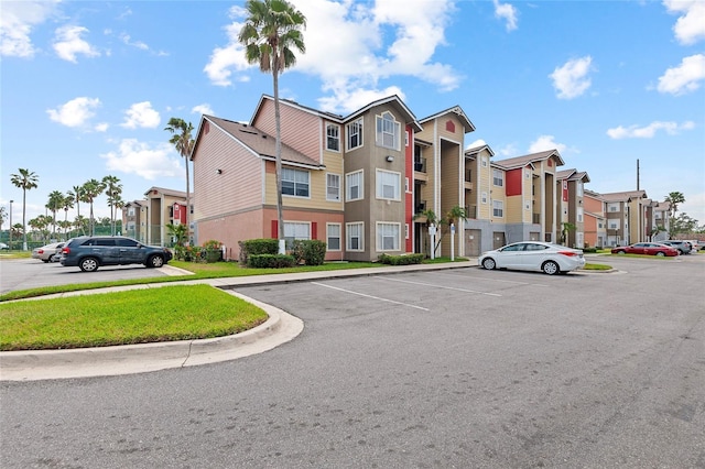 2213 Grand Cayman Ct Unit 1138, Kissimmee, FL 34741 - view of building exterior featuring uncovered parking and a residential view