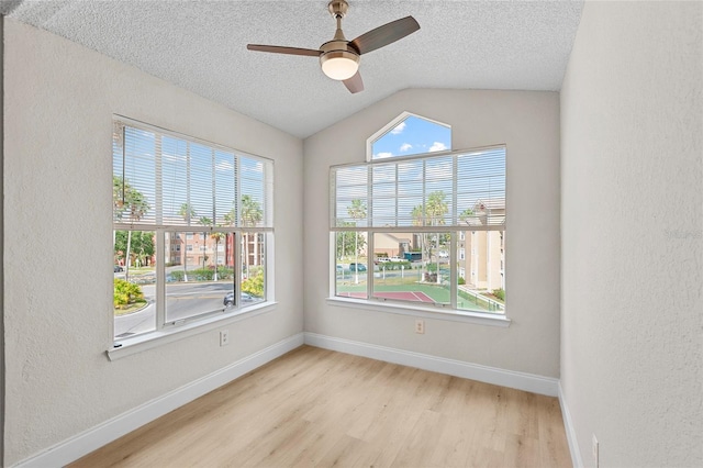 2213 Grand Cayman Ct Unit 1138, Kissimmee, FL 34741 - unfurnished room featuring wood finished floors, a textured ceiling, a textured wall, ceiling fan, and baseboards