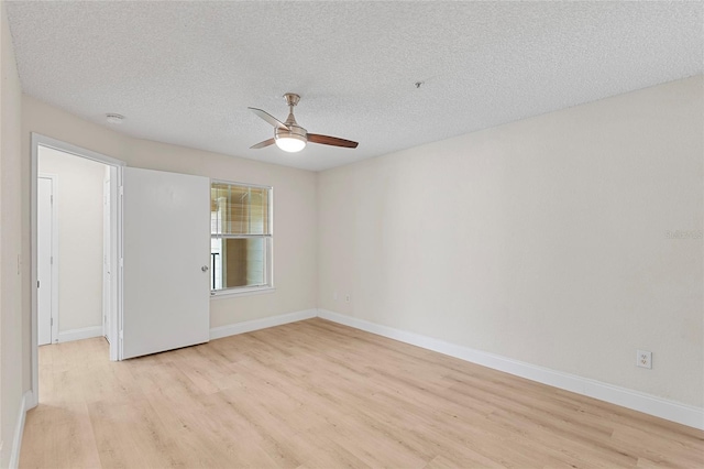 2213 Grand Cayman Ct Unit 1138, Kissimmee, FL 34741 - empty room with light wood-type flooring, ceiling fan, baseboards, a textured ceiling, and a smoke detector