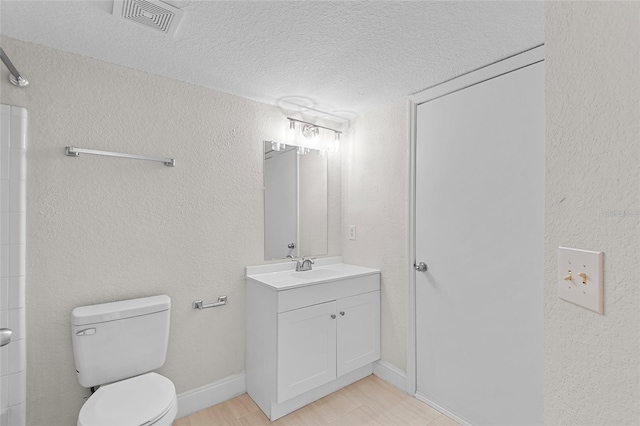 2213 Grand Cayman Ct Unit 1138, Kissimmee, FL 34741 - full bathroom with toilet, a textured ceiling, vanity, a shower, and baseboards