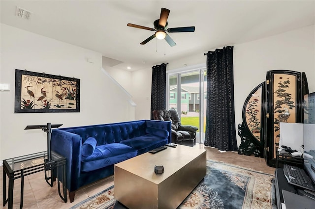 1401 Yellow Finch Dr, Davenport, FL 33837 - living room with ceiling fan and light tile patterned flooring