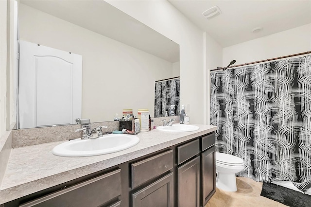 1401 Yellow Finch Dr, Davenport, FL 33837 - bathroom with double vanity, toilet, curtained shower, and tile patterned floors