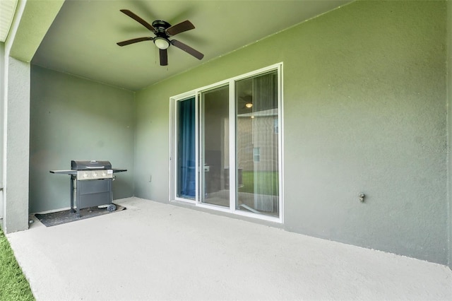1401 Yellow Finch Dr, Davenport, FL 33837 - view of patio with a ceiling fan and grilling area