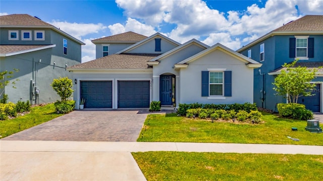 2591 Seagirt Way, Clermont, FL 34711 - traditional-style home featuring driveway, an attached garage, a front lawn, and stucco siding