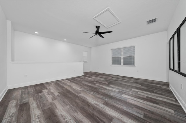 2591 Seagirt Way, Clermont, FL 34711 - empty room with dark wood-style floors, recessed lighting, baseboards, ceiling fan, and attic access