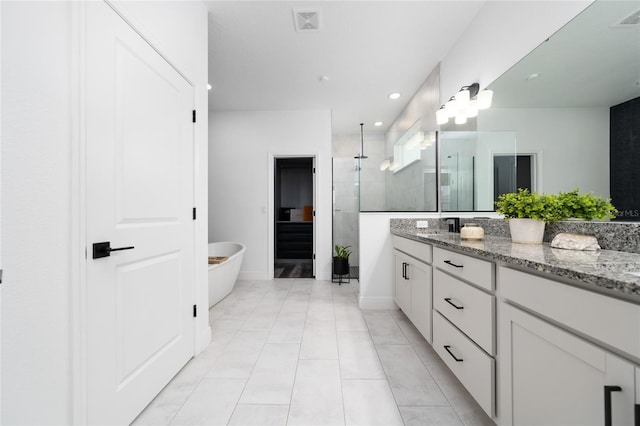 2591 Seagirt Way, Clermont, FL 34711 - bathroom featuring a tile shower, vanity, a freestanding bath, tile patterned floors, and recessed lighting