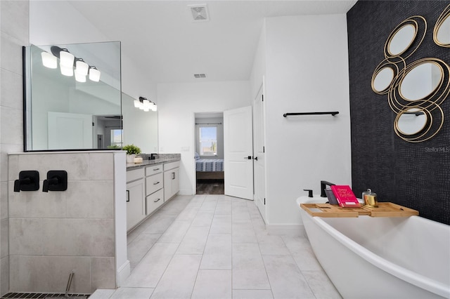 2591 Seagirt Way, Clermont, FL 34711 - ensuite bathroom featuring a freestanding tub and vanity